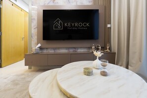 Deluxe Apartment, Balcony, City View | Living area | 50-cm Smart TV with digital channels