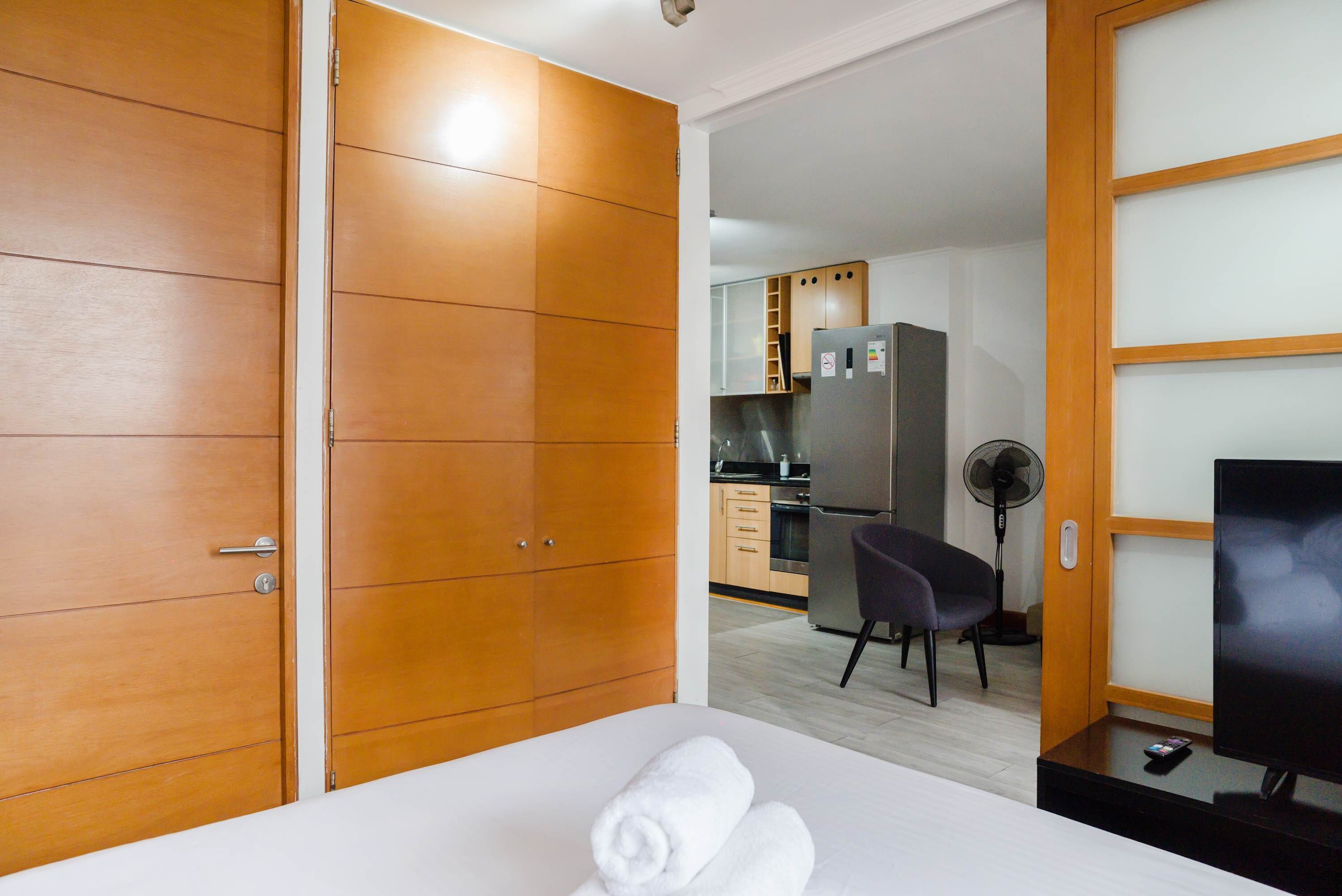Cozy studio apartment with a modern kitchen and comfortable living area, perfect for a relaxing stay.