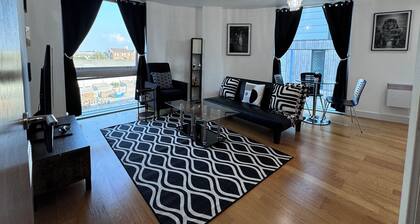 Tranquil Oasis surrounded by restaurants, shops, bars, and a multiplex cinema.