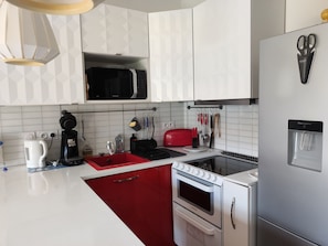 Coffee/tea maker, fridge, microwave, oven