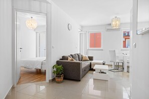 TV - Charming White Apartment with Balcony and Parking (Rovinj)