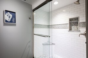 Shower, hair dryer, towels, shampoo
