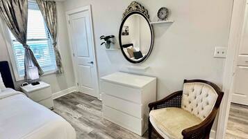 1 bedroom, desk, iron/ironing board, travel crib