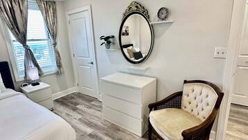1 bedroom, desk, iron/ironing board, travel crib