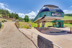 A ski lift station with a covered waiting area labeled "Angel Fire Resort." - Walk to Angel Fire Lifts! Mountain-view Condo (Angel Fire)