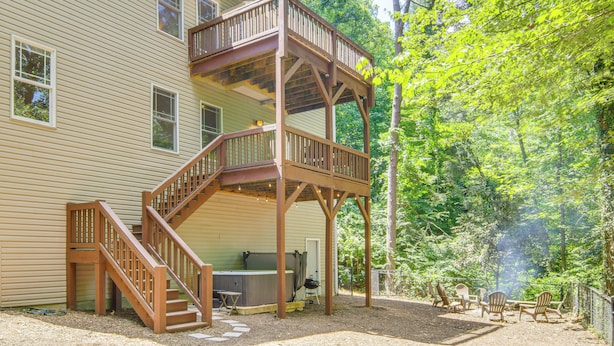 A two-story house with a wooden deck and outdoor seating area. - Black Mountain Hideaway w/ Hot Tub & Pool Table! (Black Mountain)