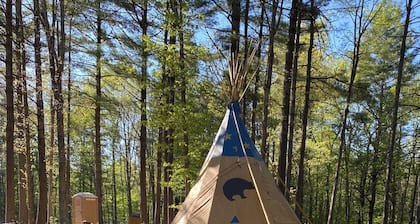Sleep under the trees in a Native American Tipi - off-grid glamping experience!