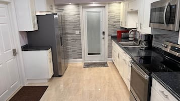 Fridge, coffee/tea maker, cookware/dishes/utensils