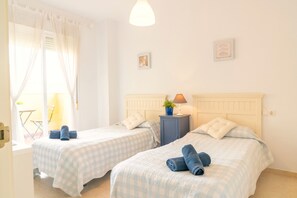 Family Apartment, 2 Bedrooms | 2 bedrooms, individually decorated, laptop workspace, iron/ironing board