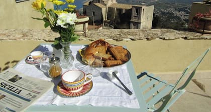 Noble palace with a sky view in the mountains, near the historic center of Erice