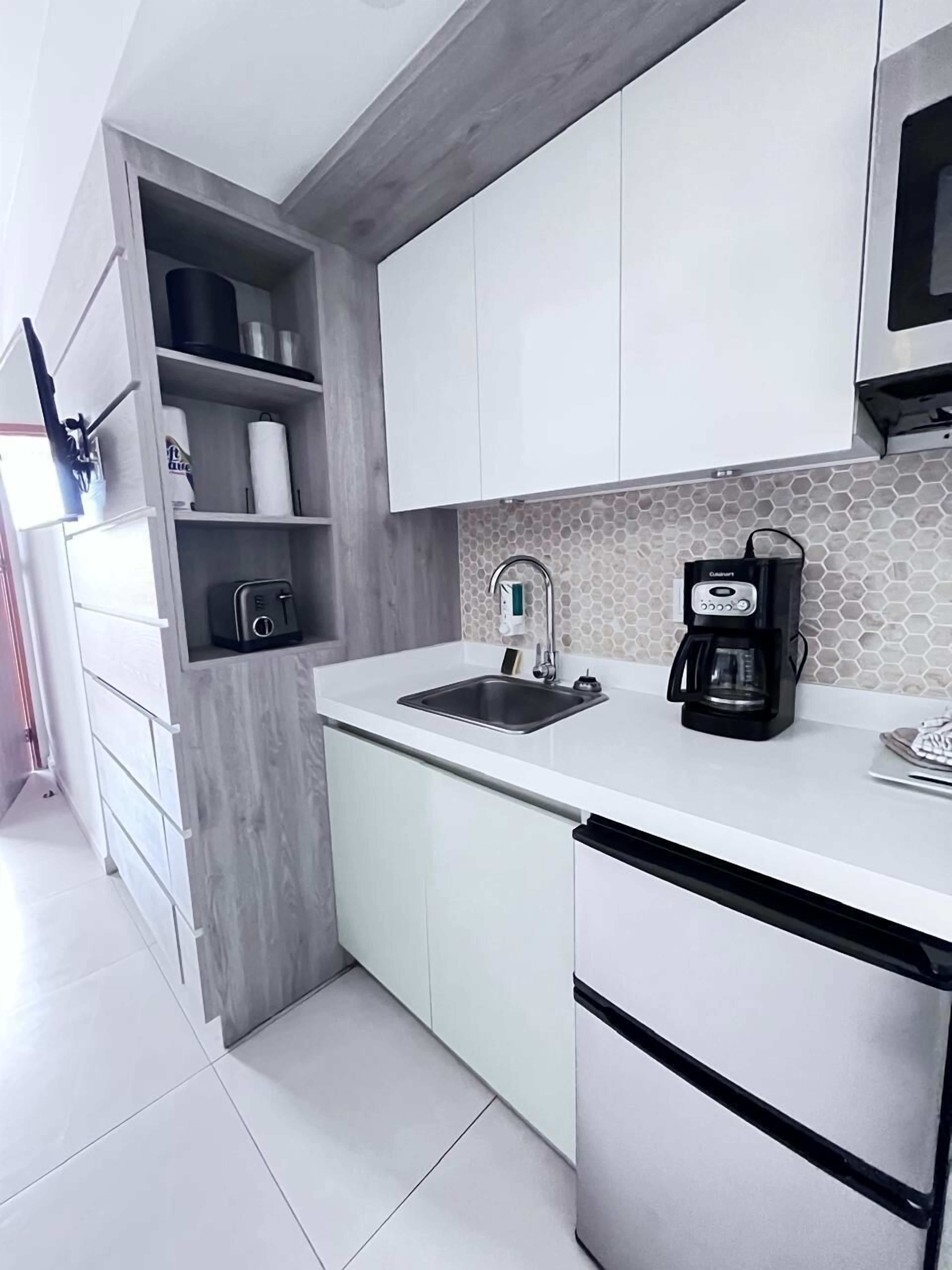 Estúdio | Cozinha privada | Frigobar, micro-ondas, fogão, cooktop