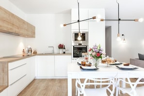 Family Apartment, Non Smoking, Ground Floor | Private kitchen | Coffee/tea maker, electric kettle, highchair - Lapwing Residence (Sopot)