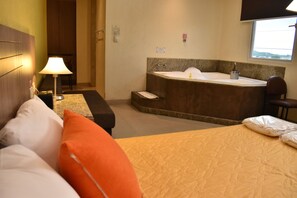 Desk, laptop workspace, blackout drapes, iron/ironing board