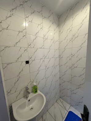 Shower, towels, soap, toilet paper - Sunflower themed room in very serene and secure environment in the city center.  (Abuja)