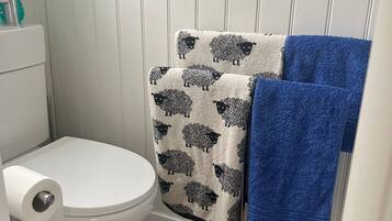 Hair dryer, towels, soap, toilet paper
