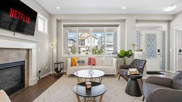 Smart TV, fireplace, books, offices