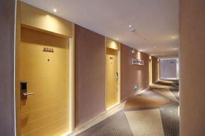 A hotel corridor with doors labeled 8320 and 841. - Tulou·He Hotel (Shanghai Songjiang New City Metro Station Branch) (Shanghai)
