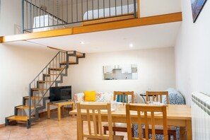 Apartment, Balcony | Living area | 35-inch TV with digital channels