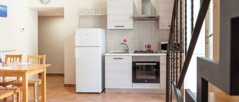 Apartment, Balcony | Private kitchen | Full-size fridge, oven, stovetop, electric kettle