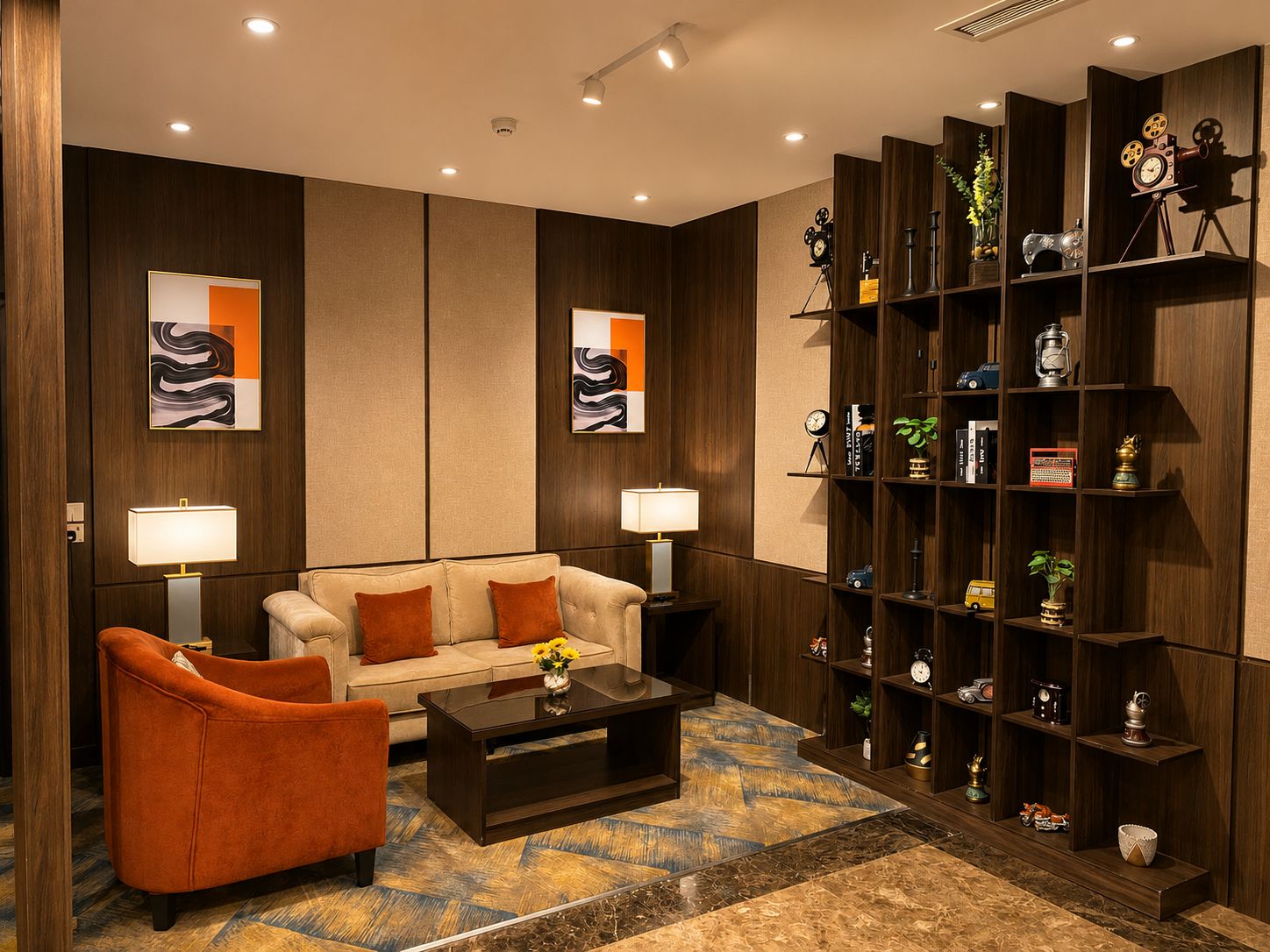 A modern living room with a sofa, armchairs, a coffee table, and a bookshelf filled with decorative items.