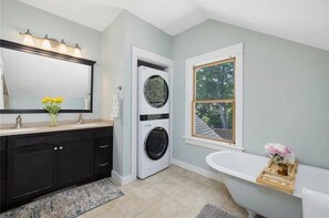 Shower, hair dryer, towels, soap