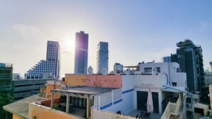 A cityscape with modern high-rise buildings and a mix of residential and commercial structures. - Ben Yehouda Obsidian (Tel Aviv)