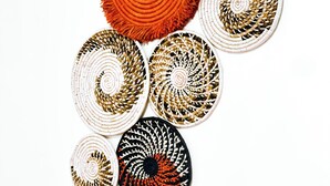A collection of circular woven mats with varying patterns and colors. - Rubee Homes (Kampala)