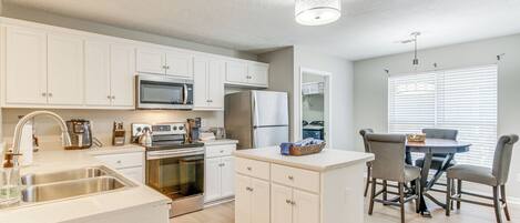Coffee/tea maker, fridge, microwave, oven