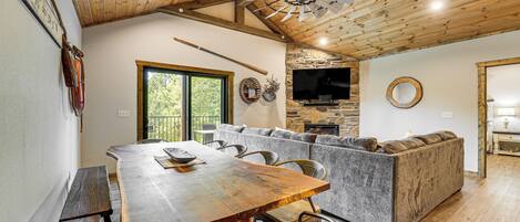 Enjoy meals together at the large dining table, or relax on the comfortable sectional sofa.