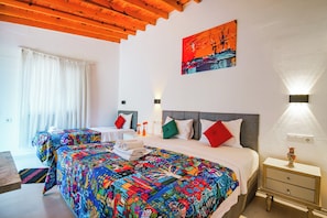 Kamar Triple Standar, pemandangan halaman | Minibar, tempat tidur bayi gratis, Wi-Fi gratis, dan seprai linen