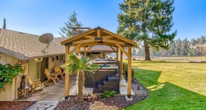 Countryside home with private swim spa, fire pit, spacious kitchen, & game room