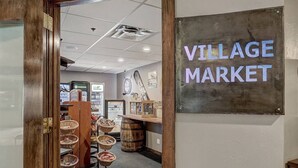 A wooden door leading into a market area with a sign reading "VILLAGE MARKET". - The Village at Breckenridge Ski-in/ski-out (Breckenridge)