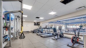 A gym with treadmills, elliptical machines, and weightlifting equipment. - The Village at Breckenridge Ski-in/ski-out (Breckenridge)