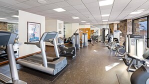 A gym with treadmills, elliptical machines, and weight machines. - Breckenridge Main Street Condominiums (Breckenridge)