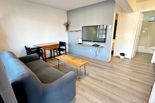 Classic Suite | Living area | 50-inch TV with cable channels