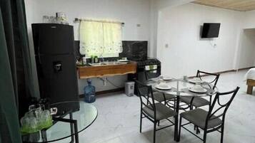 Fridge, toaster, dining tables