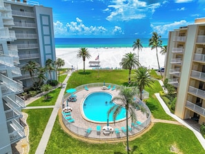 A resort with a pool, beach, and palm trees. - Jamaica Royale Beach View Tower by Beachside Management (Siesta Key)