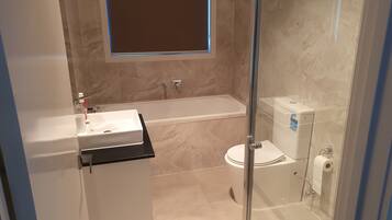 Shower, hair dryer, towels, soap