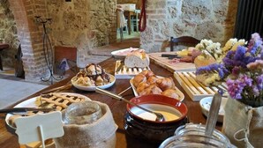 A breakfast buffet with various pastries, a bowl of soup, and a vase of flowers. - Villa La Cascata -  with swimming pool (Chiusi)