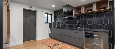 Fridge, microwave, stovetop, coffee/tea maker