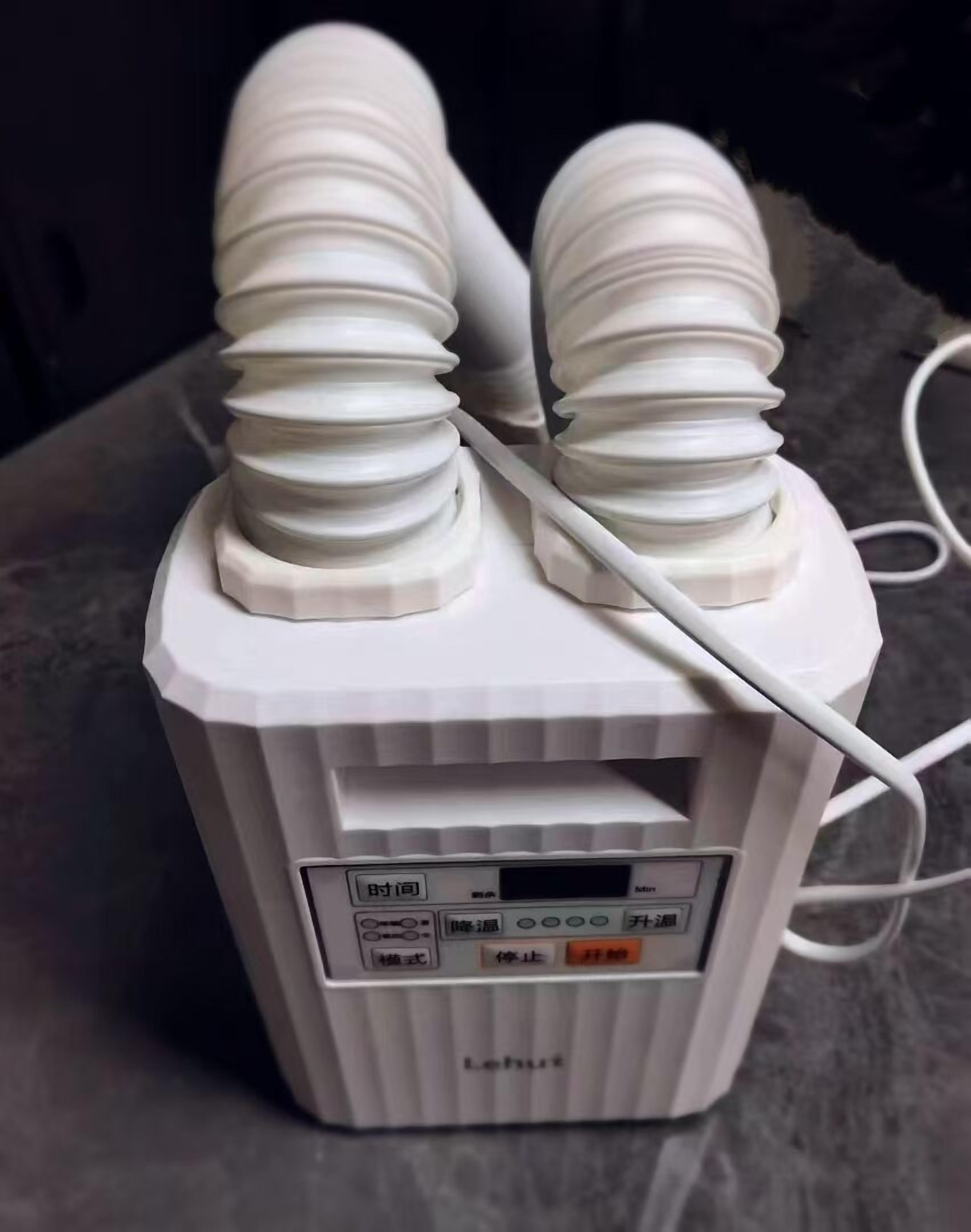 A white portable heater with a digital display and control buttons.