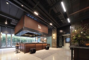 A modern kitchen with a T& coffee station, large windows, and a decorative plant. - Shanghai T Plus Hotel Residence (Shanghai)