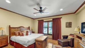 A bedroom with a wooden bed, a chest of drawers, a desk, a chair, and a window with curtains. - 2BR Main St Condo, Walk to Ski Lift! (Park City)