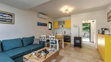 Family House, 2 Bedrooms, Microwave, Mountainside (Beachside House Lara) | Living area | Flat-screen TV