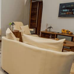 Family Suite, Balcony, Lake View | Living area | 43-inch TV with cable channels, fireplace