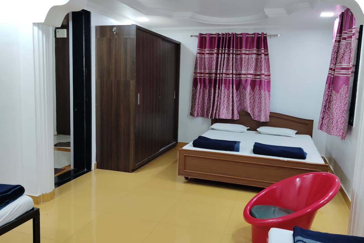 Habitación cuádruple familiar | 1 dormitorio y ropa de cama