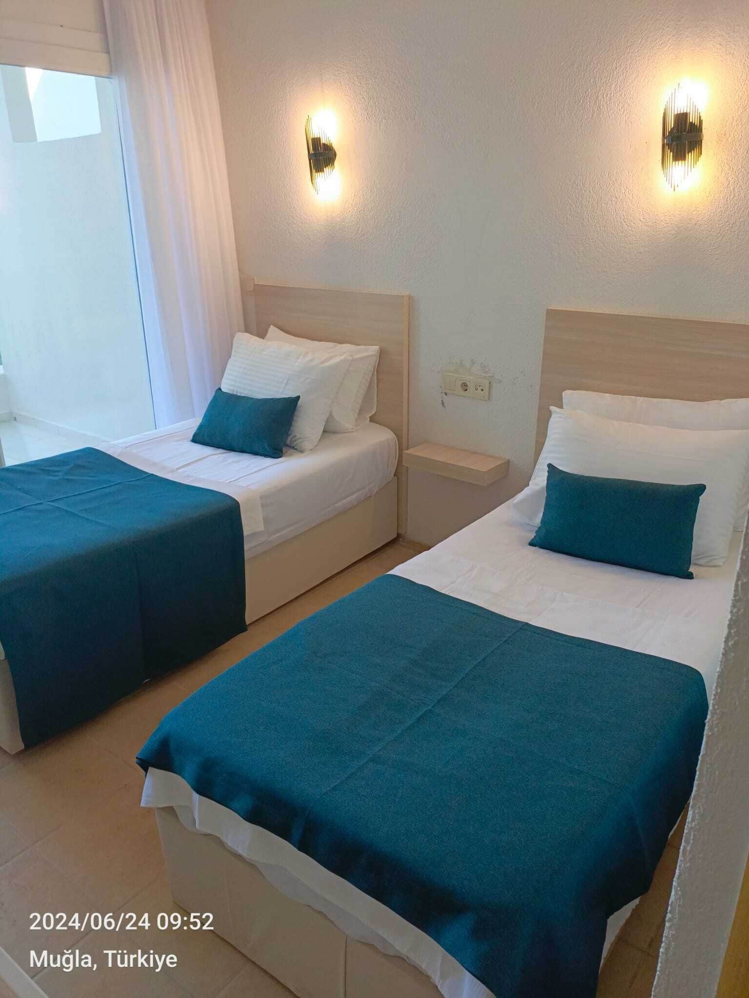 Standard Room, Multiple Beds, Partial Sea View | Minibar, free WiFi