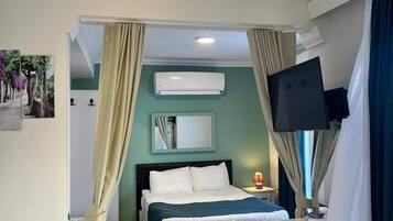 Family Suite, Garden View | Minibar, free WiFi