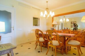 Dine in comfort with a traditional dining table and comfortable chairs.