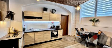 Family Apartment, 2 Bedrooms, Kitchen, Courtyard Area | Private kitchen | Full-size fridge, microwave, oven, stovetop